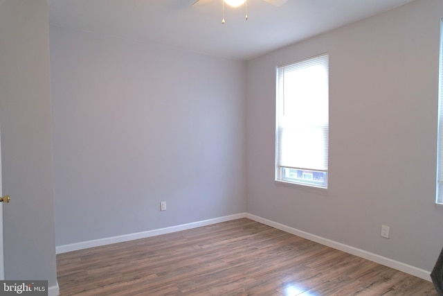 spare room featuring ceiling fan and hardwood / wood-style floors