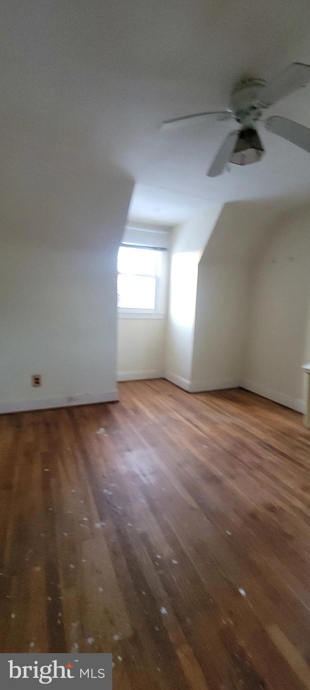 bonus room featuring ceiling fan and hardwood / wood-style floors