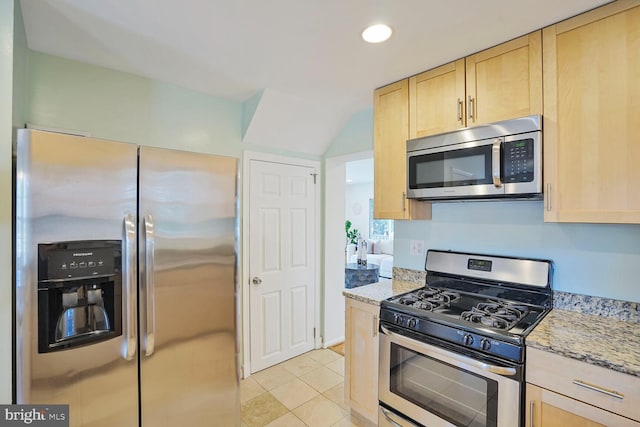 kitchen with light brown cabinets, light stone counters, recessed lighting, appliances with stainless steel finishes, and light tile patterned flooring