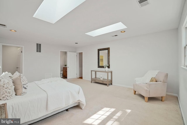 bedroom with a skylight, baseboards, and visible vents