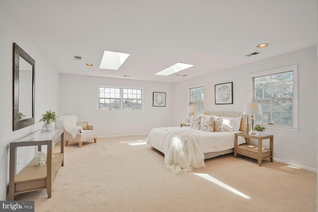 bedroom featuring multiple windows, visible vents, and carpet floors