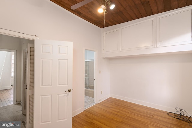 interior space featuring wood ceiling, light hardwood / wood-style flooring, ceiling fan, and vaulted ceiling