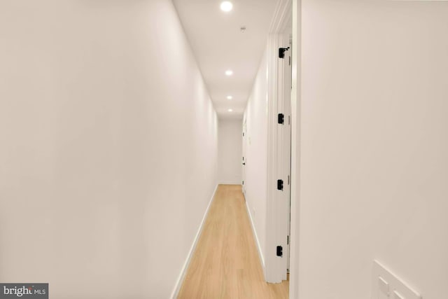 corridor with light wood-type flooring