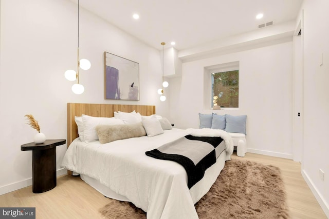 bedroom with hardwood / wood-style floors