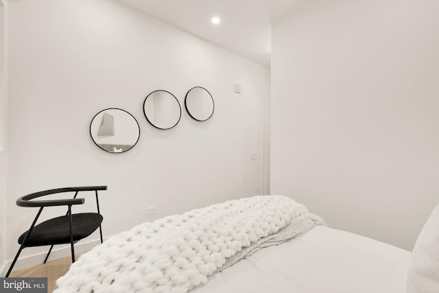 bedroom with wood-type flooring