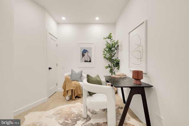 sitting room with light hardwood / wood-style floors