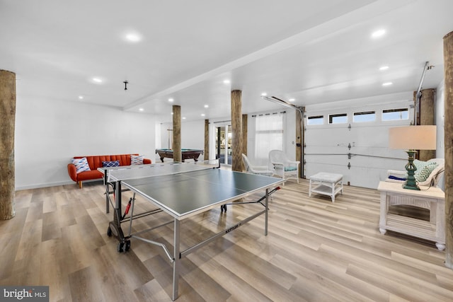 game room with light hardwood / wood-style floors