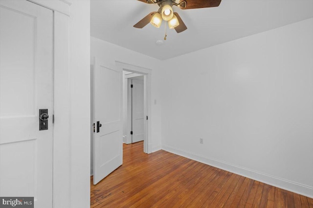 unfurnished room featuring ceiling fan and light wood-type flooring