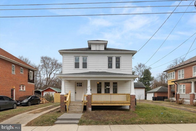 front of property with a front yard and covered porch