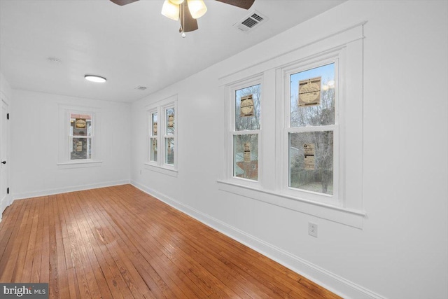 unfurnished room featuring hardwood / wood-style flooring and ceiling fan