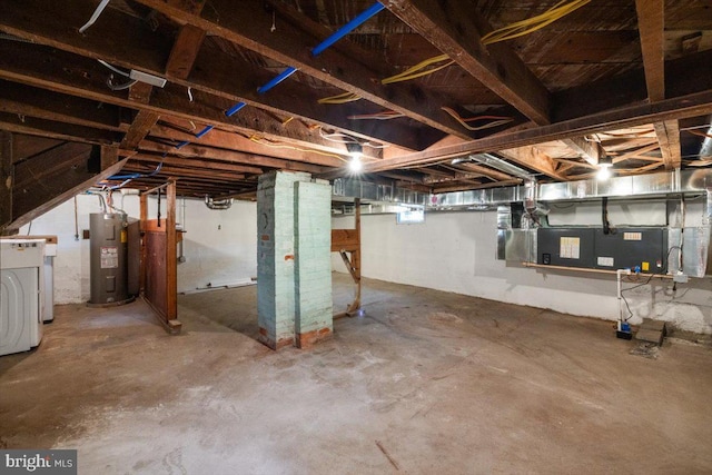 basement with water heater and washer / clothes dryer