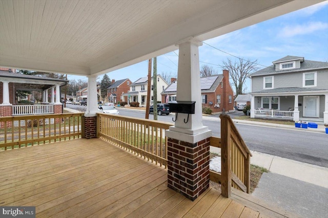 wooden terrace with a porch