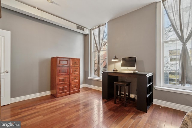 office featuring wood-type flooring and plenty of natural light