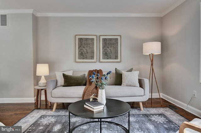 living room with hardwood / wood-style flooring and ornamental molding