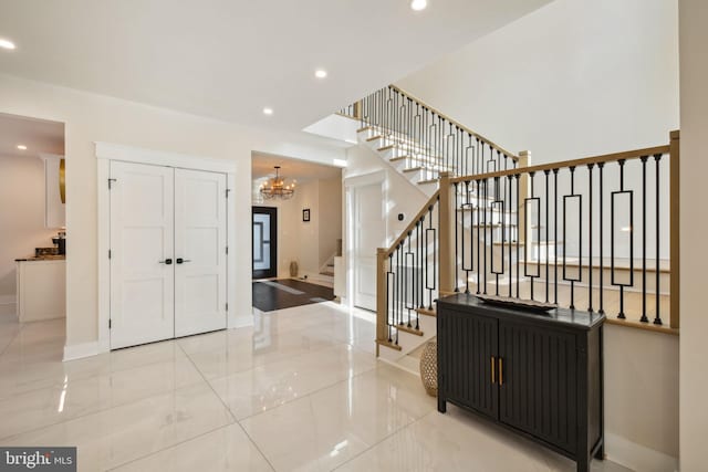 foyer with a chandelier