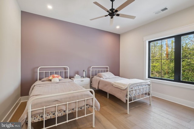 bedroom featuring wood-type flooring and ceiling fan