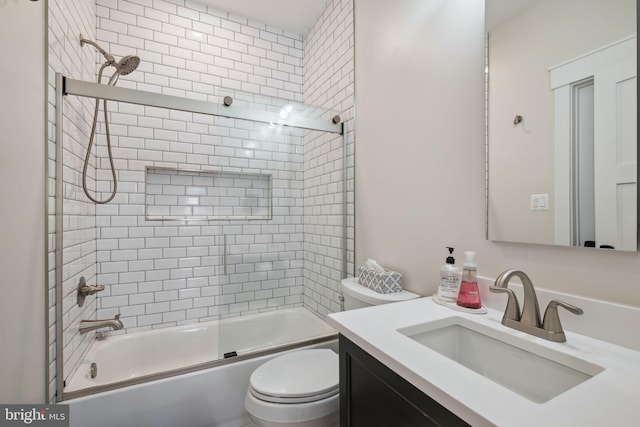 full bathroom with vanity, toilet, and combined bath / shower with glass door