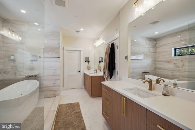 bathroom with vanity, tile patterned floors, and independent shower and bath