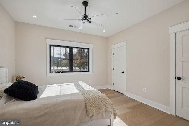 bedroom featuring light hardwood / wood-style floors and ceiling fan