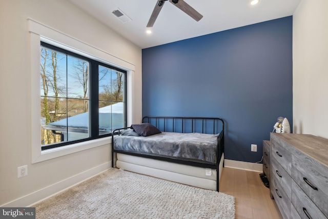 bedroom featuring ceiling fan and light hardwood / wood-style floors