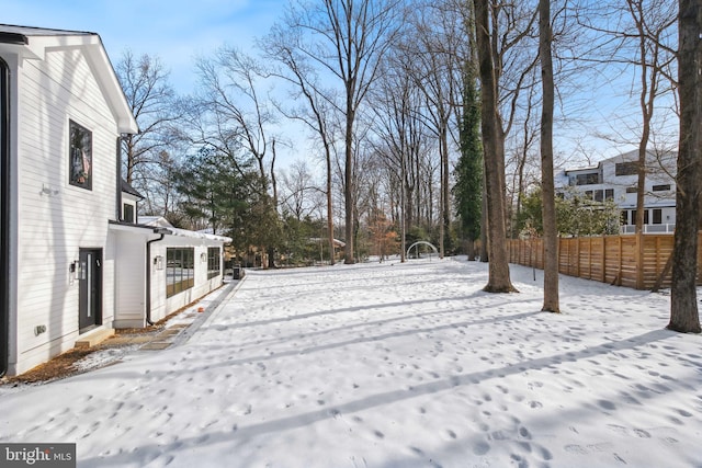 view of yard layered in snow