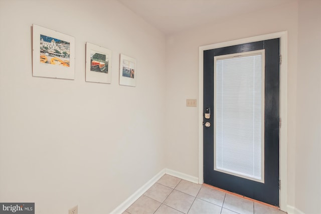 entryway with light tile patterned floors