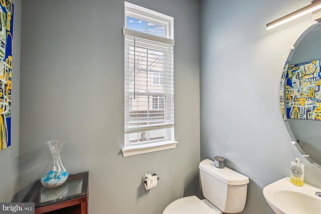 bathroom with toilet and sink