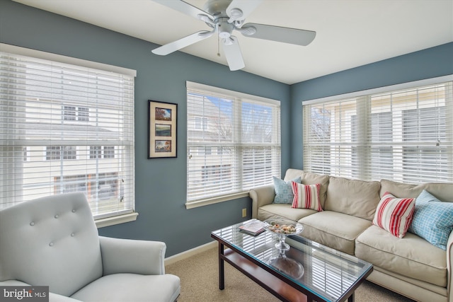 living room with carpet floors and ceiling fan