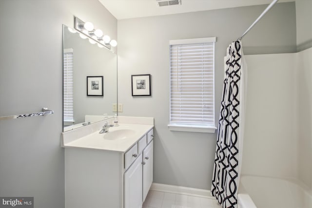 bathroom with vanity and shower / bath combo