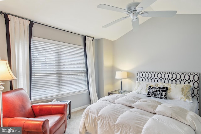 carpeted bedroom featuring lofted ceiling and ceiling fan