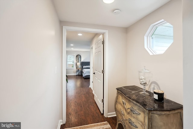 hall with dark wood-type flooring