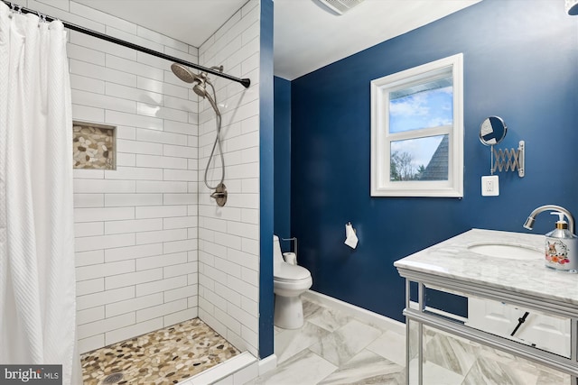 bathroom with vanity, toilet, and walk in shower