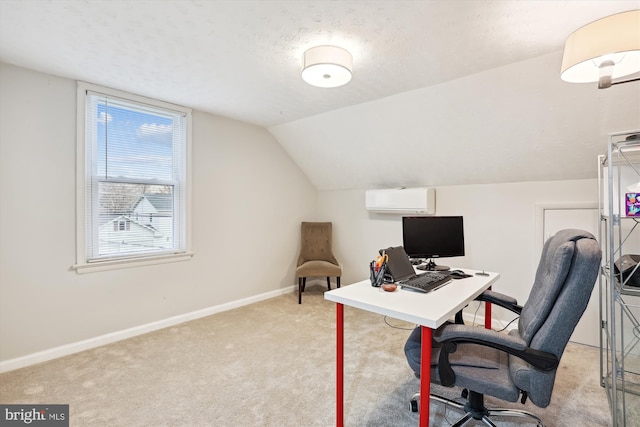 home office with an AC wall unit, light colored carpet, lofted ceiling, and a textured ceiling