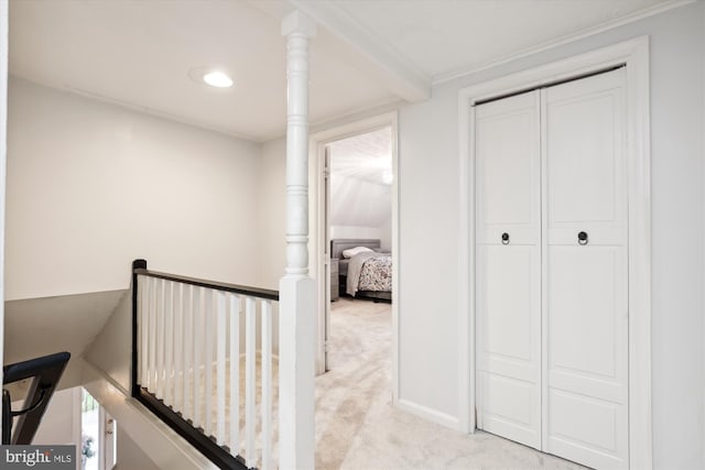 hallway with light colored carpet