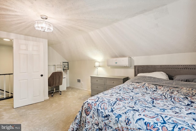 carpeted bedroom featuring vaulted ceiling, a wall mounted AC, and a textured ceiling