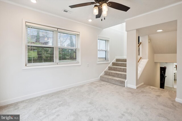 interior space featuring crown molding and ceiling fan