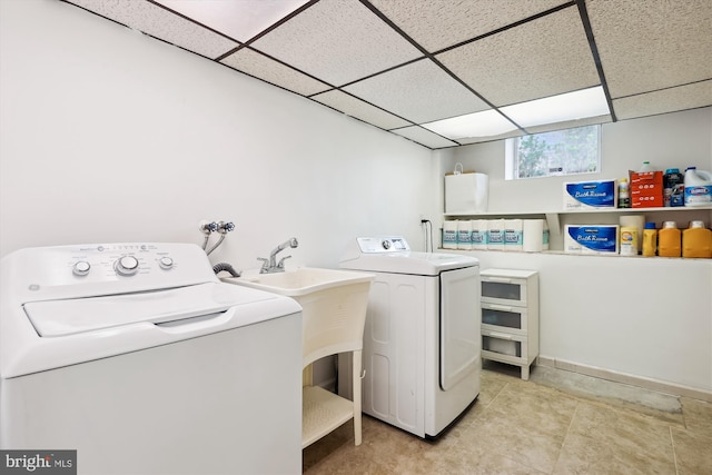 laundry area featuring light tile patterned flooring and independent washer and dryer