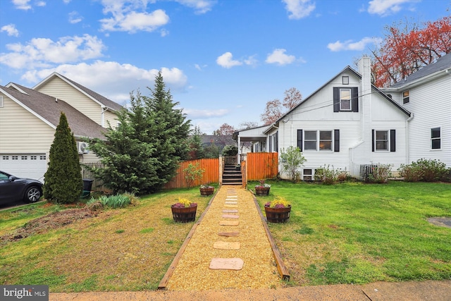 view of front of house featuring a fire pit and a front yard