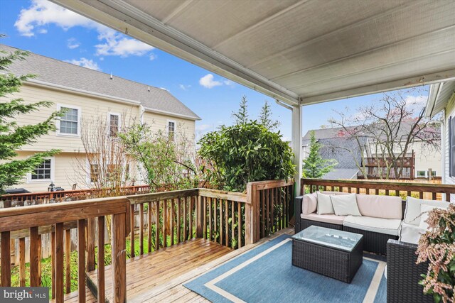 wooden deck with outdoor lounge area