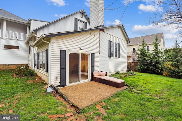 rear view of house with a lawn