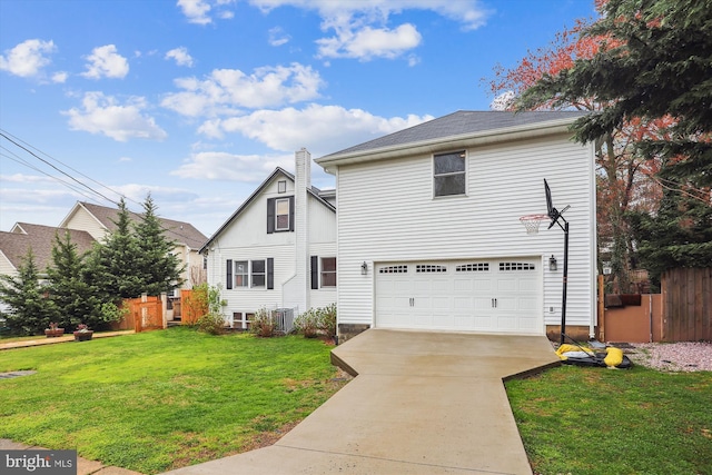 front facade featuring central AC unit, a garage, and a front yard