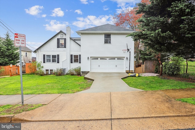 front of property with a garage and a front lawn