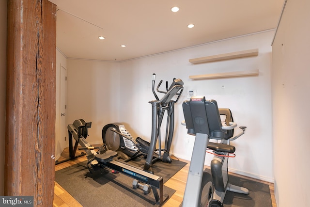 workout room with hardwood / wood-style flooring