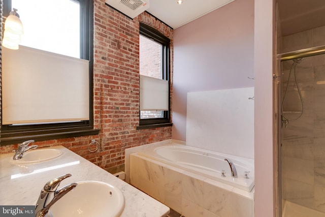 bathroom with vanity, plenty of natural light, and plus walk in shower