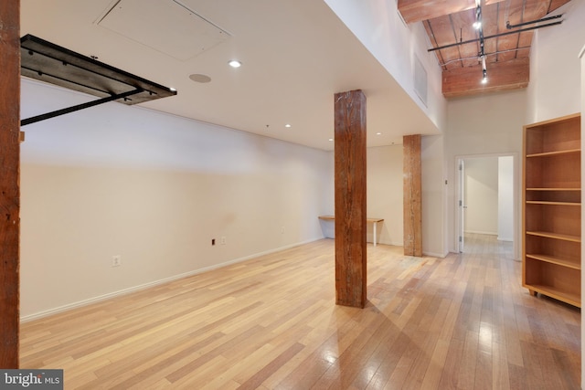 basement featuring light hardwood / wood-style flooring