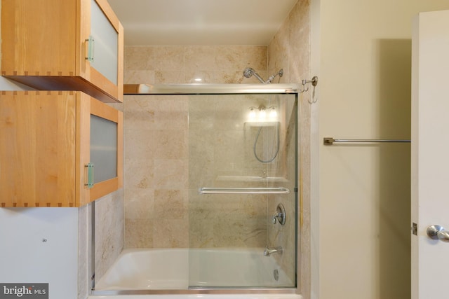 bathroom featuring enclosed tub / shower combo