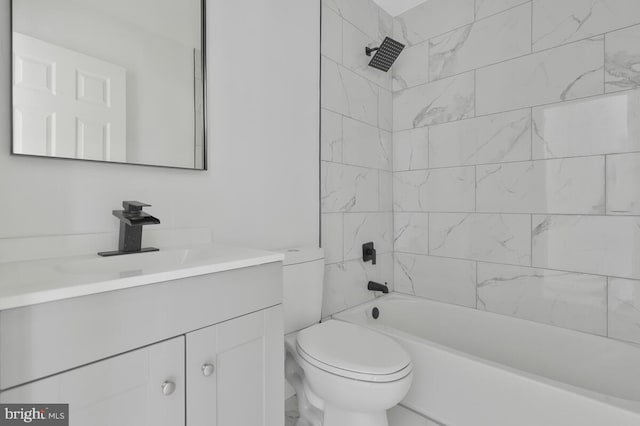 full bathroom featuring vanity, toilet, and tiled shower / bath