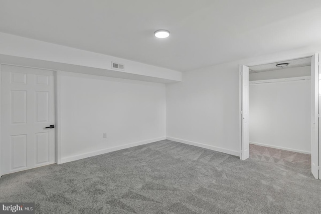 unfurnished bedroom with light carpet and a closet