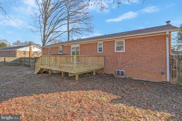 rear view of house with a deck and central air condition unit