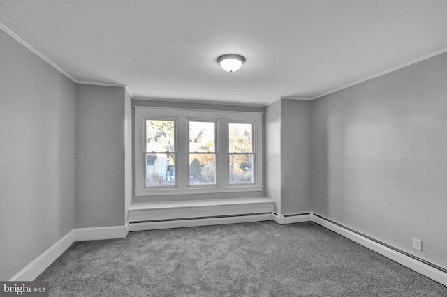 carpeted spare room featuring ornamental molding